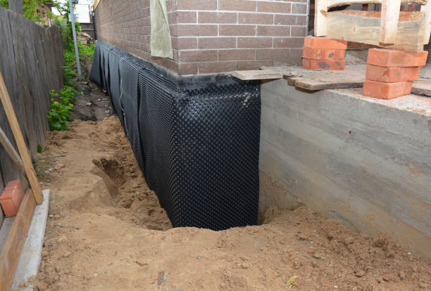 SJ Waterproofing Pros technician performing targeted Sump Pump Installation assessment in Brownsboro, AL